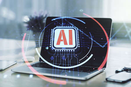 Double exposure of creative artificial Intelligence abbreviation with computer on background. Future technology and AI conceptの写真素材