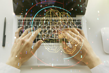 Creative artificial Intelligence concept with human brain sketch and hands typing on computer...