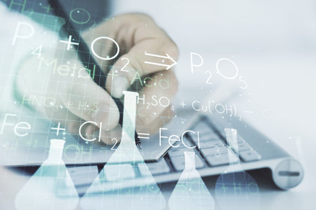 Creative chemistry illustration with hand writing in diary on background with laptop, science and...
