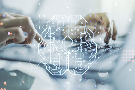 Creative artificial Intelligence concept with human brain hologram and hands typing on laptop on...