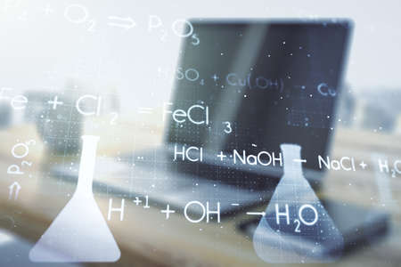 Double exposure of creative chemistry concept and modern desktop with laptop on background, research and development conceptの写真素材