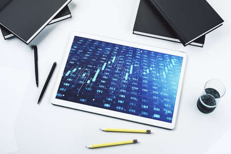 Modern digital tablet monitor with abstract statistics data hologram interface, computing and analytics concept. Top view. 3D Renderingの写真素材
