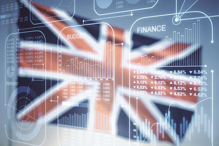 Abstract virtual stats data hologram on flag of Great Britain and sunset sky background. Multiexposureの写真素材