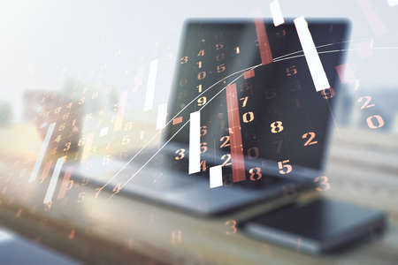 Abstract creative financial graph and modern desktop with pc on background, financial and trading concept. Multiexposureの写真素材