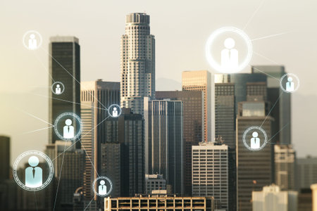 Double exposure of social network icons hologram on Los Angeles office buildings background....