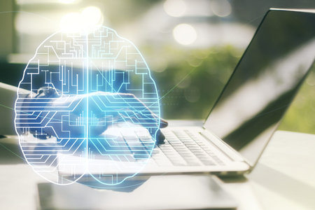 Double exposure of creative artificial Intelligence symbol with hands typing on laptop on...