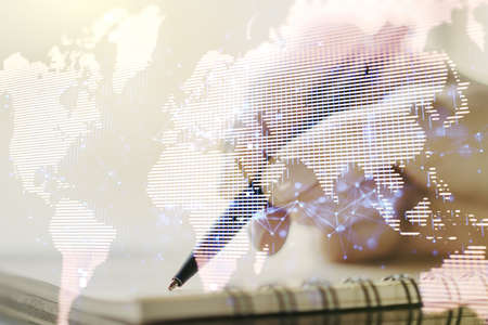 Double exposure of abstract digital world map and woman hand writing in notepad on background, big data and blockchain conceptの写真素材