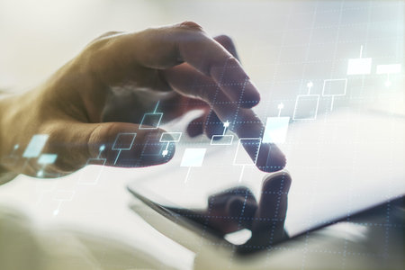 Double exposure of abstract creative financial diagram with finger clicks on a digital tablet on...