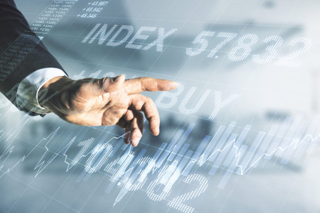 Double exposure of man hand clicks on abstract creative financial chart hologram on blurred office...