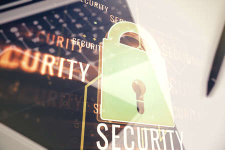 Double exposure of creative lock hologram with chip on laptop background. Information security conceptの写真素材