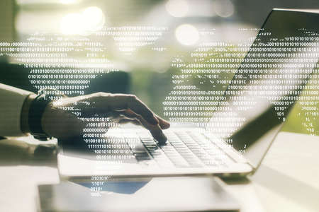 Double exposure of abstract digital world map and hand typing on laptop on background, research and strategy conceptの写真素材
