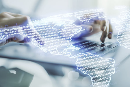 Double exposure of digital America map and hands typing on laptop on background, research and...
