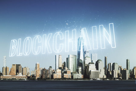 Double exposure of abstract virtual blockchain technology hologram on New York city skyscrapers...