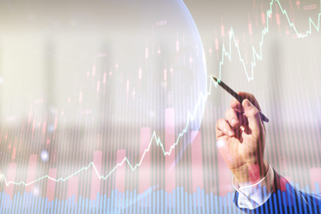 Man hand with pen working with abstract creative financial graph and world map on blurred office...