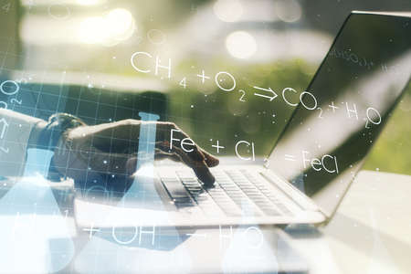 Creative chemistry illustration with hands typing on computer keyboard on background, science and research concept. Multiexposureの写真素材