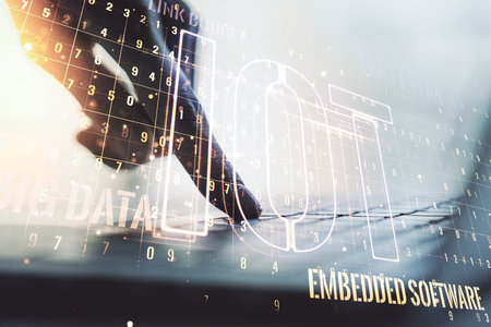 Creative IOT concept with hands typing on laptop on background. Multiexposureの写真素材