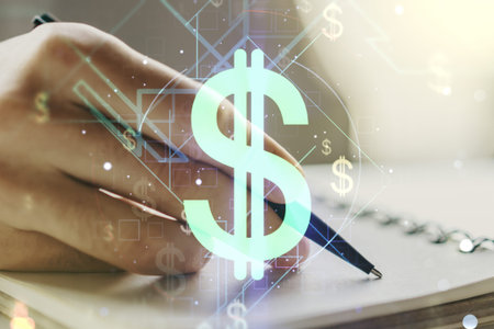 Creative concept of USD symbols illustration and man hand writing in notebook on background. Trading...