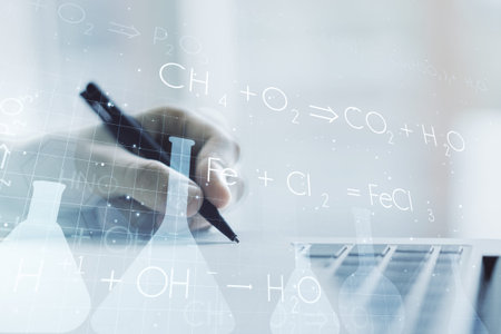 Creative chemistry illustration with hand writing in diary on background with laptop, science and...