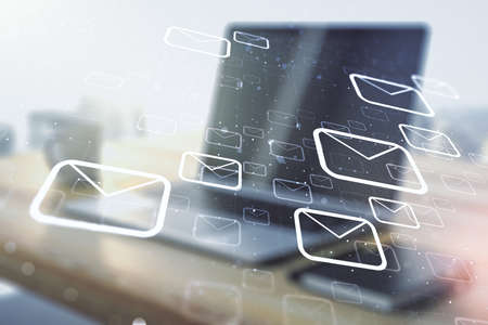 Creative concept of postal envelopes illustration and modern desktop with computer on background. Email and communications concept. Multiexposureの写真素材