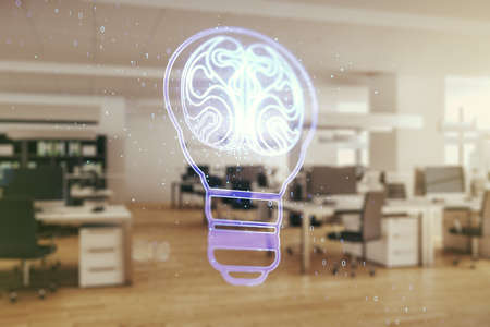 Abstract virtual creative light bulb with human brain hologram on a modern furnished office interior background, artificial Intelligence and neural networks concept. Multiexposureの写真素材