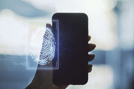 Abstract creative fingerprint concept and hand with phone on background. Multiexposureの写真素材
