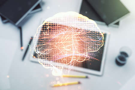Double exposure of creative human brain microcircuit and modern digital tablet on background. Future technology and AI conceptの写真素材