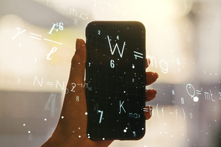 Double exposure of creative scientific formula concept and hand with cell phone on background,...