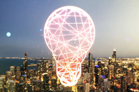 Double exposure of creative light bulb hologram on Chicago city skyscrapers background, research and development conceptの写真素材