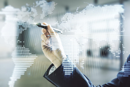 Double exposure of man hand with pen working with abstract digital world map on blurred office background, research and strategy conceptの写真素材