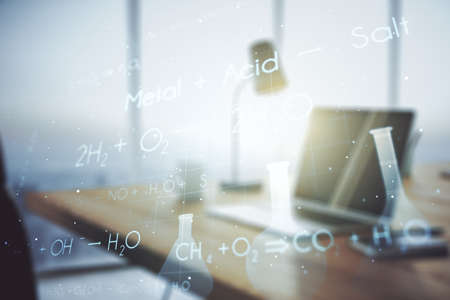 Double exposure of creative chemistry concept on laptop background, research and development conceptの写真素材