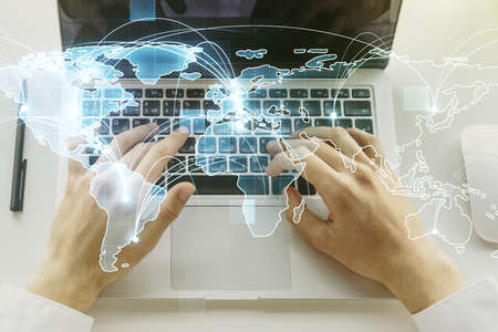 Abstract graphic digital world map with connections and hands typing on computer keyboard on background, globalization concept. Multiexposureの写真素材