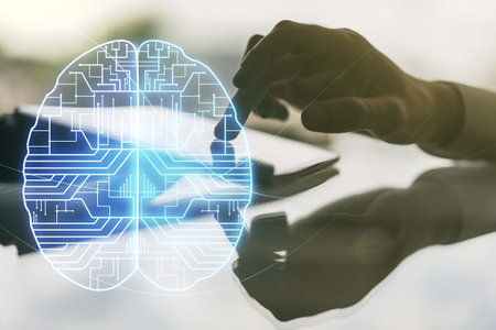 Double exposure of creative human brain microcircuit and hand working with a digital tablet on...