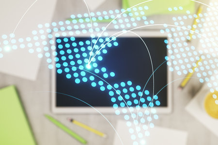 Abstract creative world map with connections and modern digital tablet on background, top view, international trading concept. Multiexposureの写真素材