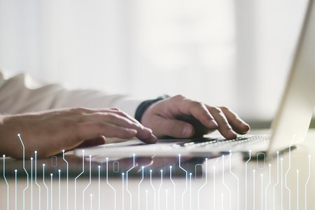 Double exposure of circuit hologram and hands typing on laptop on background. Research and development hardware conceptの写真素材