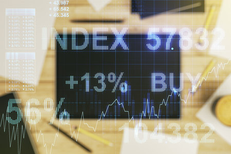 Multi exposure of abstract creative financial chart and digital tablet on background, top view, research and analytics conceptの写真素材