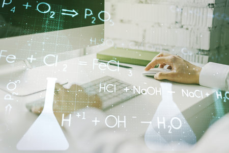 Creative chemistry hologram with hands typing on computer keyboard on background, pharmaceutical research concept. Multiexposureの写真素材