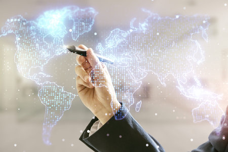 Multi exposure of man hand with pen working with abstract graphic world map on blurred office...