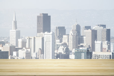 Blank wooden tabletop with beautiful San Francisco skyline at daytime on background, mockupの写真素材