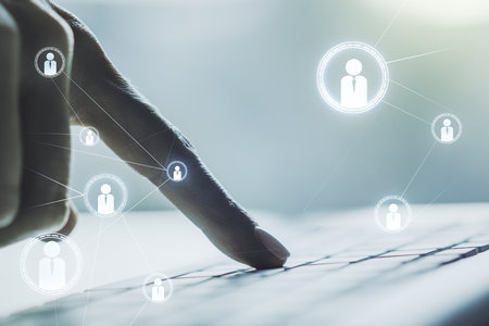 Double exposure of social network icons concept with hand typing on computer keyboard on background. Networking conceptの写真素材
