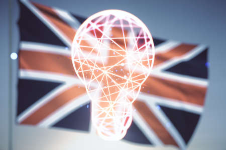 Double exposure of creative light bulb hologram on British flag and blue sky background, research and development conceptの写真素材