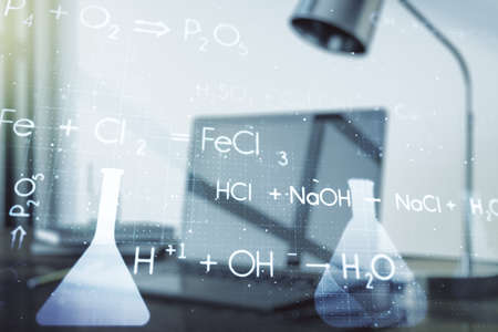 Double exposure of creative chemistry concept on laptop background, research and development conceptの写真素材