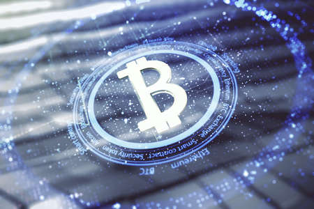 Double exposure of creative Bitcoin symbol hologram on blurry metal background. Cryptocurrency conceptの写真素材