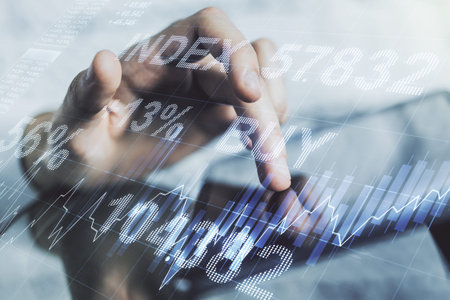 Double exposure of abstract creative financial chart with finger clicks on a digital tablet on...