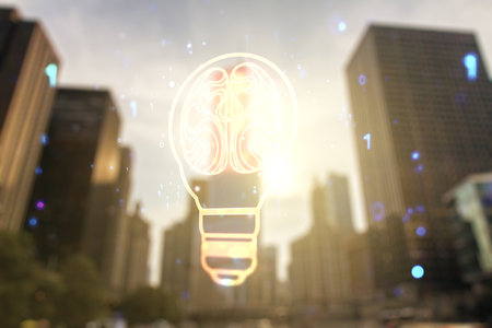 Abstract virtual idea concept with light bulb and human brain illustration on office buildings background. Neural networks and machine learning concept. Multiexposureの写真素材