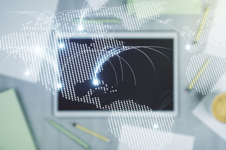 Double exposure of abstract digital world map with connections and digital tablet on background, top view, research and strategy conceptの写真素材
