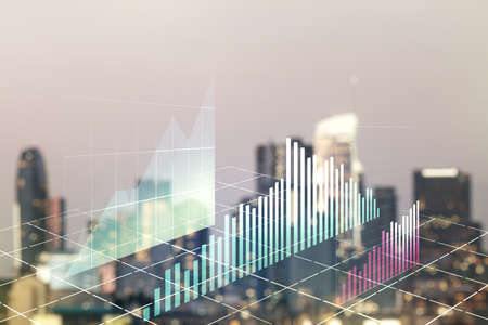 Abstract virtual financial graph hologram on blurry skyline background, forex and investment concept. Multiexposureの写真素材