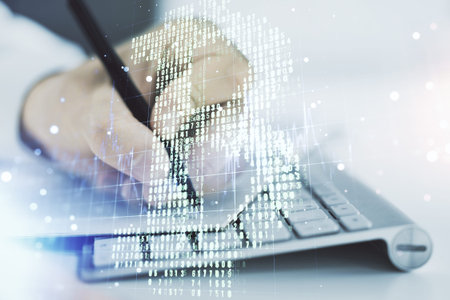 Double exposure of creative Bitcoin symbol hologram with hand writing in notepad on background with...