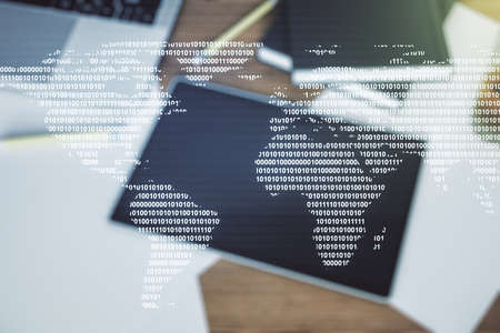 Multi exposure of abstract creative digital world map and modern digital tablet on background, top view, tourism and traveling conceptの写真素材