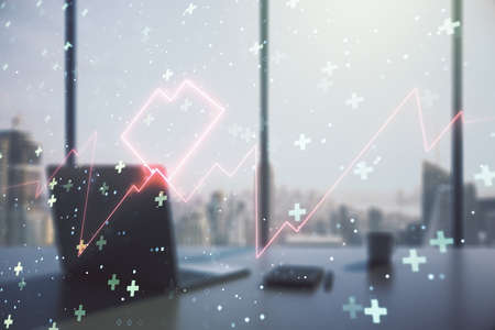 Double exposure of creative abstract heart rate hologram and modern desktop with laptop on background. Healthcare technolody conceptの写真素材