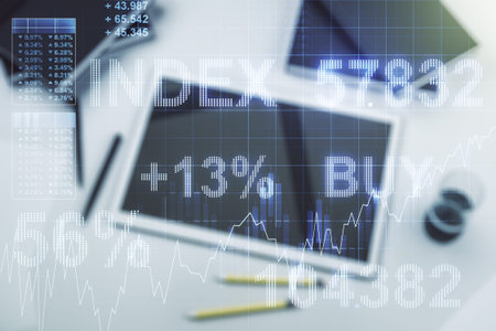 Multi exposure of abstract financial graph and modern digital tablet on desktop on background, top...